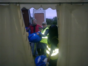 Baggage off load in the wet and midge infested camp